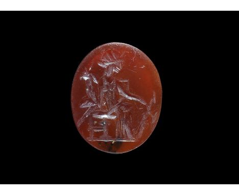 1st-3rd century AD. A carnelian intaglio with an image of the goddess Fortuna seated and holding a cornucopia and rudder. 0.7