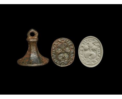 13th-14th century AD. A bronze chessman seal matrix with hexagonal-section shank, collar and quatrefoil suspension loop; to t