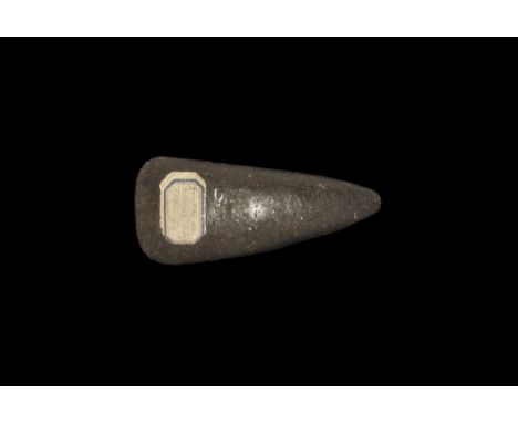 Neolithic, 5th-3rd millennium BC. A knapped and polished epidiorite axehead with old collector's label ' Fouilles de Herines 