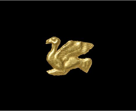 3rd-7th century AD. A gold foil plaque of a duck with wings spread, head raised; three small loops to the reverse for attachm