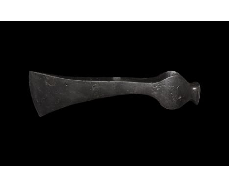 11th-13th century AD. A hand-forged iron axehead with triangular-section narrow blade extending to a narrow curved edge, sock