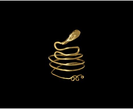 Roman Period, 30 BC-323 AD. A gold snake ring formed from a stout wire, the body coiled, the neck twisted into a figure-eight