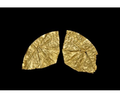 6th century AD. A group of two gold-foil fragments of a Type D bracteate with contiguous design of a broad stamped border and