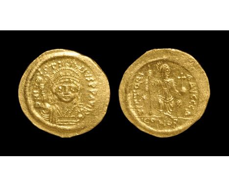 565-578 AD. Constantinople mint. Obv: DN IVSTINVS PP AVG legend with beardless, helmeted bust facing, holding Victory on glob