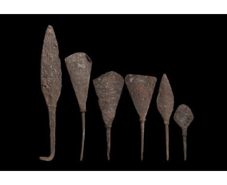 12th-15th century AD. A mixed group of iron arrow heads comprising: one leaf-shaped, square-section tang with right-angled ti