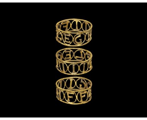 1st-2nd century AD. A broad openwork gold hoop with beaded wire borders, filigree loops enclosing cast D-section letters 'LEG