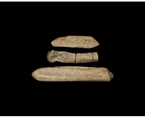 Neolithic, 4th-3rd millennium BC. A mixed group of bone implements comprising: one long with small shallow cuts; one tongue-s