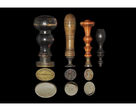 19th-20th century AD. A mixed group of matrices comprising: a desk seal with turned ebonised handle, the brass oval seal face