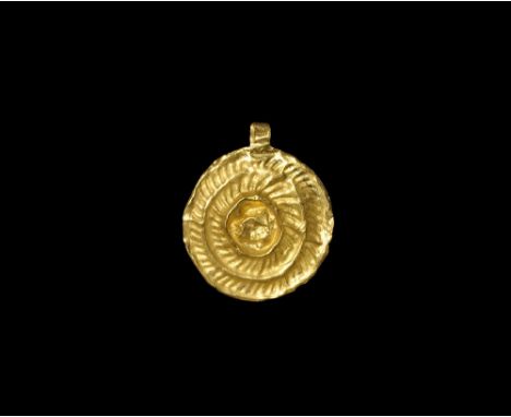 3rd-4th century AD. A flat-section gold discoid plaque with concentric ropework bands, integral loop. 0.74 grams, 27mm (1"). 