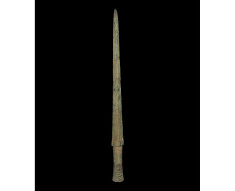 12th-11th century BC. A large Bronze Age Type 4 javelin head with sturdy, thick, lozenge-section blade, tubular socket with r