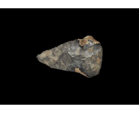 Upper Acheulian, 400,000-300,000 BP. A Lower Palaeolithic piriform flint hand axe with mottled grey pattination, flattened ha