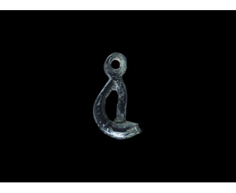 10th-12th century AD. A bronze pendant formed as a serpent with the tail looped and returned to the top of the head; incised 