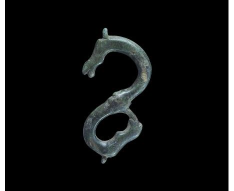 15th-16th century AD. A bronze S-shaped belt fastener with zoomorphic heads to both ends with one beast's tongue forming part