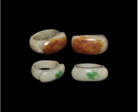19th-20th century AD. A matched pair of carved finger rings, each a barrel-shaped hoop with cartouche bezel, the smaller in j