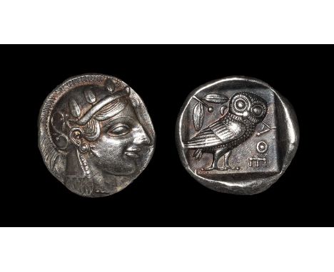 475-465 BC. Obv: head of Athena right, wearing earring, necklace, and crested Attic helmet decorated with three olive leaves 