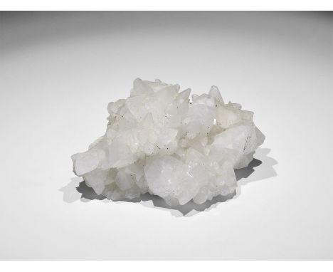 . An unusual group of scalenohedral calcite crystals formed on the hollows left by a previous generation of calcite crystal t