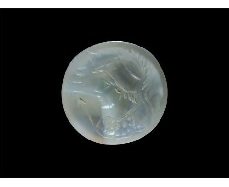 1st-2nd century AD. An intaglio of lightly coloured agate with a bust of Minerva wearing helmet and holding spear; to the fro