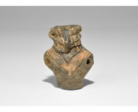 Neolithic, 6th-5th millennium BC. A bulbous terracotta figurine with chevron band to the chest and back, looped arms and ears