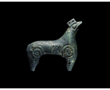 11th century AD. A gilt-bronze half of a Ringerike style Great Beast finial for a Viking longship's weathervane formed as a s