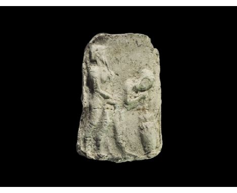 20th-18th century BC. A rectangular ceramic plaque with high-relief scene of a a woman drinking through a straw from a pitche