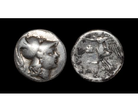 205-100 BC. Obv: head of Athena right, wearing crested Corinthian helmet. Rev: Nike walking left, holding wreath; pomegranate