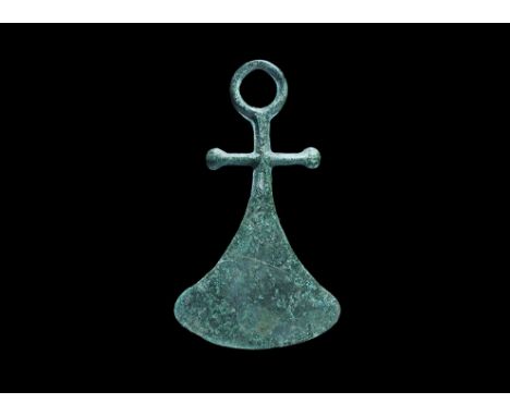 11th-13th century AD. A bronze axe pendant with integral suspension loop, transverse bar with lobe finials, flared blade with