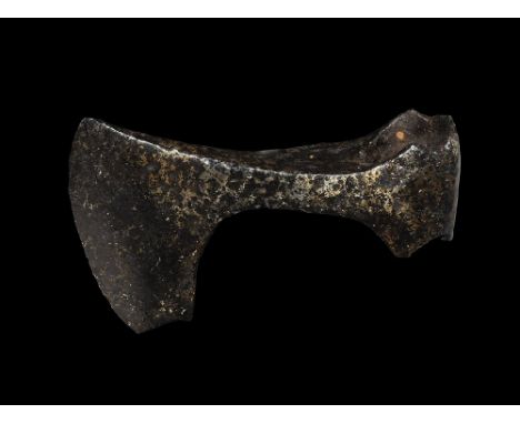 9th-11th century AD. A hand-forged iron axehead with triangular-section narrow blade widening to a broad bevelled edge with s