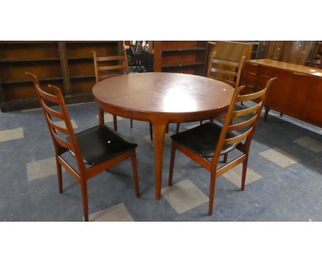 A 1970's Danish Stained Teak Circular Extending Dining Table Together with Four Ladder Back Chairs by Scantic 