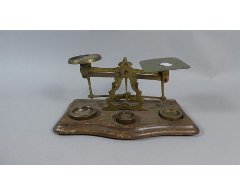 A Pair of Late Victorian/Edwardian Brass Postage Scales with Weights on Wooden Plinth, 23cm Wide 