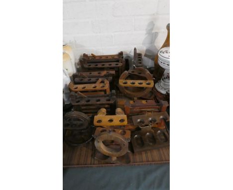 A Collection of Fourteen Various Wooden Novelty Pipe Stand 