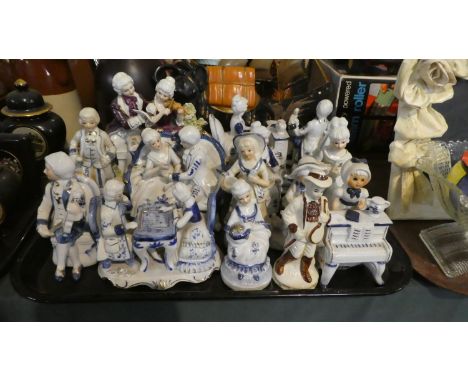 A Tray Containing Various Continental Glazed Ceramic Figural Ornaments 