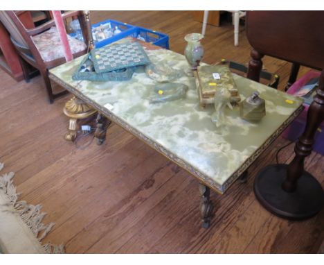 A rectangular onyx and gilt metal coffee table, a similar standard lamp, and a turned wood standard lamp, two onyx ashtrays, 