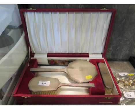 A silver brush and comb set with engine turned decoration in original presentation box