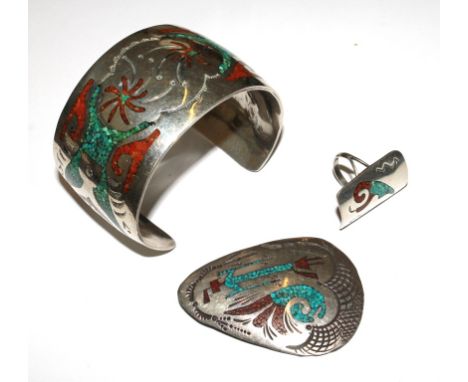 A trio of white metal bangle pendant and ring, all inlaid (possibly Egyptian)