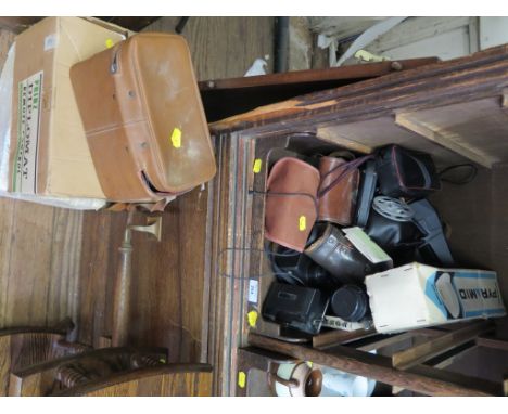 Various photographic equipment, including Polaroid cameras, Pentax K100 SLR camera, Cine cameras and projectors