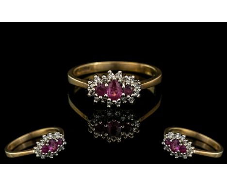 Ladies 9ct Gold Attractive Ruby And Diamond Set Ring Full Hallmark For 9.325. Ring Size M. Weight 2.1 grams. 