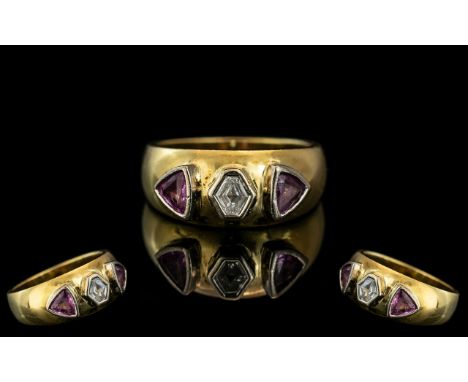 18ct Diamond Designer Ring, set with a hexagon shaped diamond between two trillion cut rubies.  Fully hallmarked, ring size R