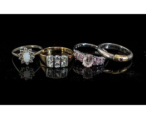 9ct White Gold Dress Ring set with pink stones, weight 2.9 grams, together with three unmarked white metal and yellow metal r