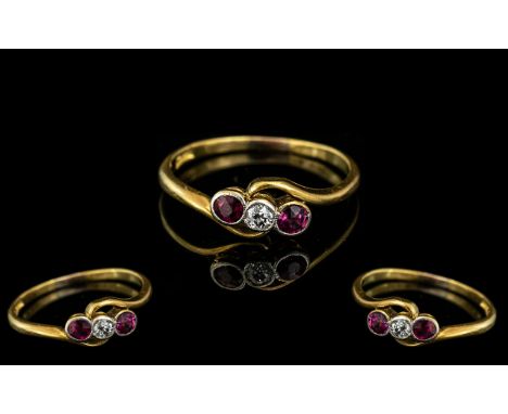 18ct Gold Antique Ruby &amp; Diamond Ring, central diamond surround by two rubies on a twist.  Hallmarked 18 ct.  Ring size M