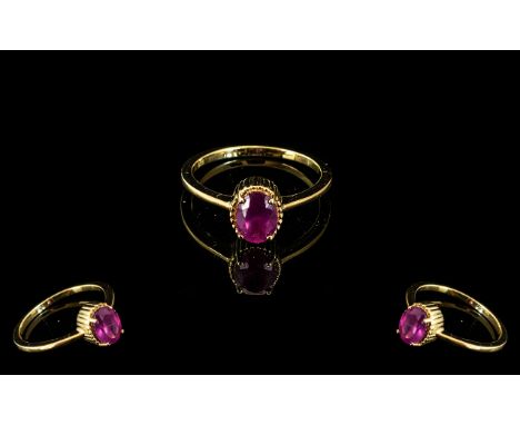 Ruby Solitaire Ring, an oval cut solitaire ruby, of excellent colour and of just under 2cts, claw set in a simple ridged moun