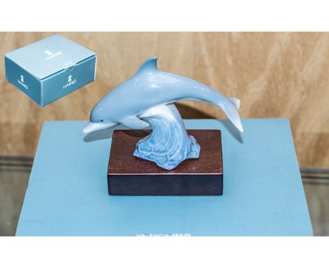Lladro Baby Dolphin with Stand - Titled ' Lucky Dolphin ' Model No 01008104. Approx Size 4 by 3 Inches. Stamped Lladro and Si