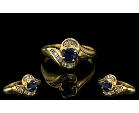 18ct Gold Sapphire &amp; Baguette Cut Diamond Ring, central Sapphire between channel set baguettes.  Ring size K/L.