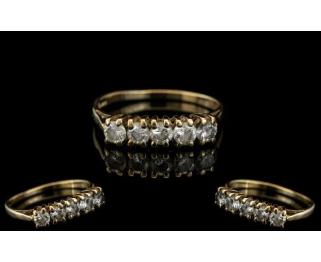 A 9ct Gold Dress Ring Set With 5 CZ's. 