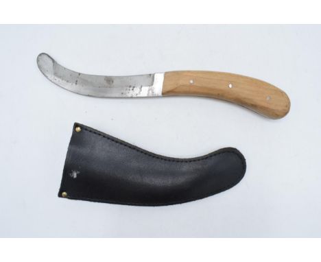 A parachute release knife with original leather scabbard, circa 1960s, made by A Wright &amp; Sons Sheffield. 28.5cm long wit