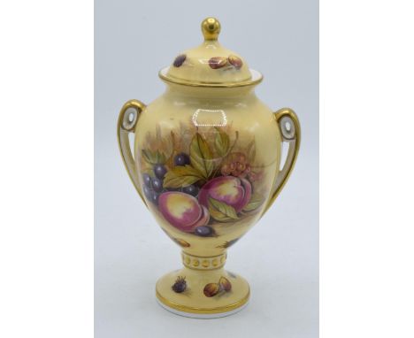 Aynsley Orchard Gold 23cm tall two-handled lidded urn with gilded decoration. Signed D. Jones.  In good condition with no obv