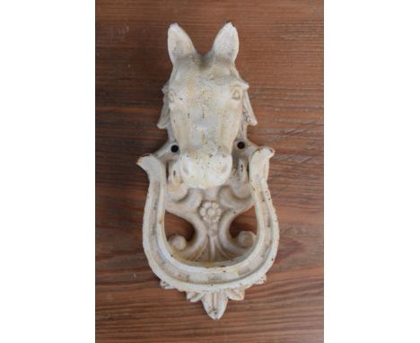 A vintage 20th century painted white cast metal door knocker in the form of a horse's head, 18cm tall.  