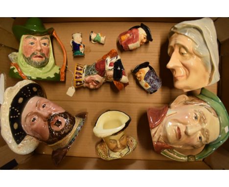 A collection of Toby and Character jugs to include Beswick Scrooge and Henry VIII, Sylvac Henry VIII, Kingston Pottery charac