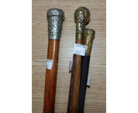 An East Yorkshire Regiment walking stick; 3 swagger sticks