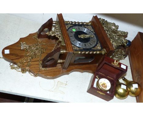 A reproduction brass and oak wall clock with double weight driven movement; a reproduction magnified pocket/table watch