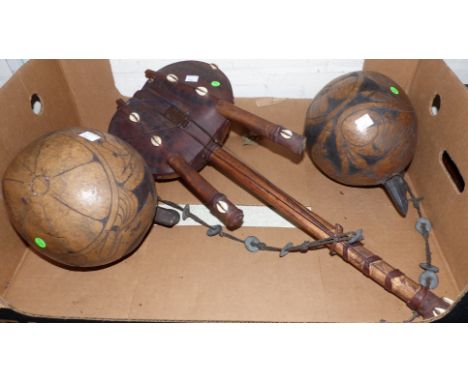 Two African carved gourds and a tribal string instrument